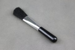 Optics cleaning brush